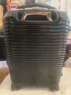 Sleek Black Hard-Shell Rolling Storage Case by